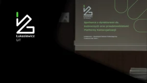 Grafika informująca o spotkaniu kadry zarządzającej instytutów Sieci Badawczej Łukasiewicz w Łukasiewicz – GIT